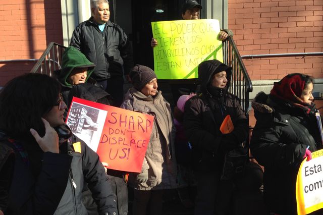 Tenants of 533 46th Street in Sunset Park on the steps of their building on Wednesday. Ixtilico is center.